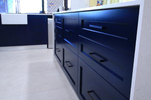 Shaker style cabinets and drawers in navy blue