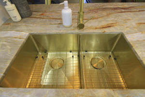 Butlers sink with gold tapware